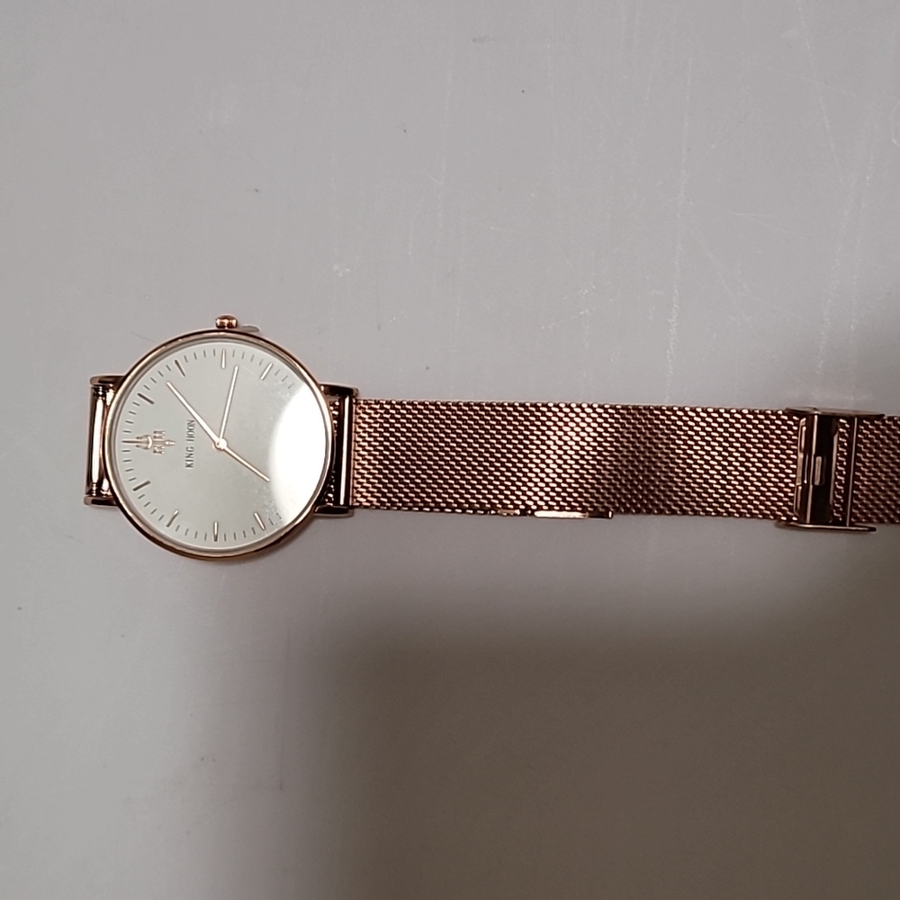 Rose gold metal watch